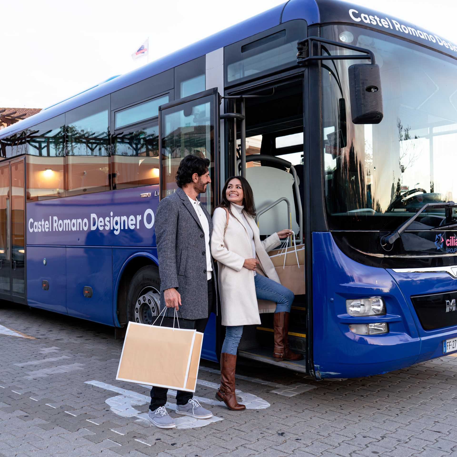 man and women taking the shuttle bus